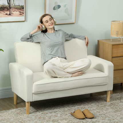 Dvivietė sofa, kreminės baltos spalvos, kaučiukmedžio kojelės, aksominis audinys