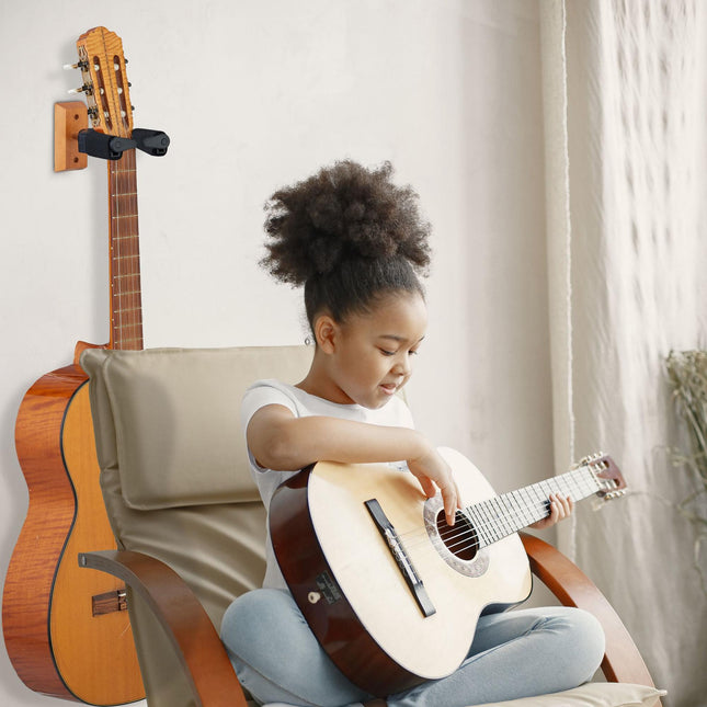 Gitaros laikiklis ant sienos
