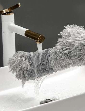Telescopic dust brush with two attachments